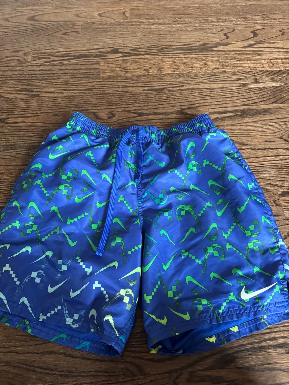 Nike Blue Swim Shorts with Green Logo Print